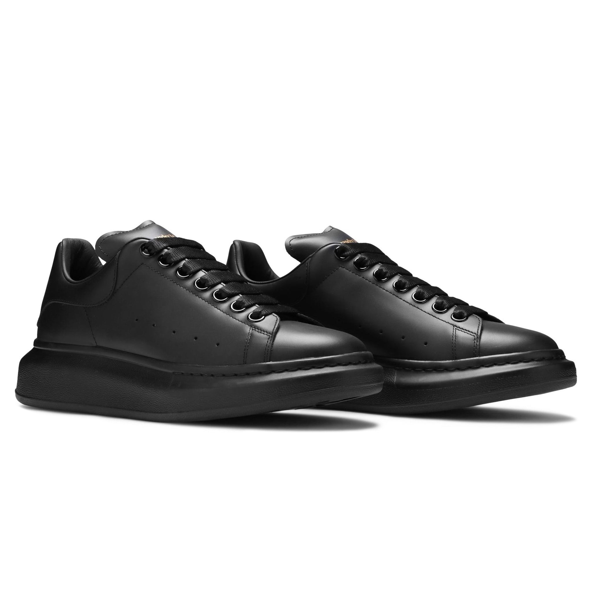 Front side view of Alexander Mcqueen Raised Sole Triple Black Sneaker